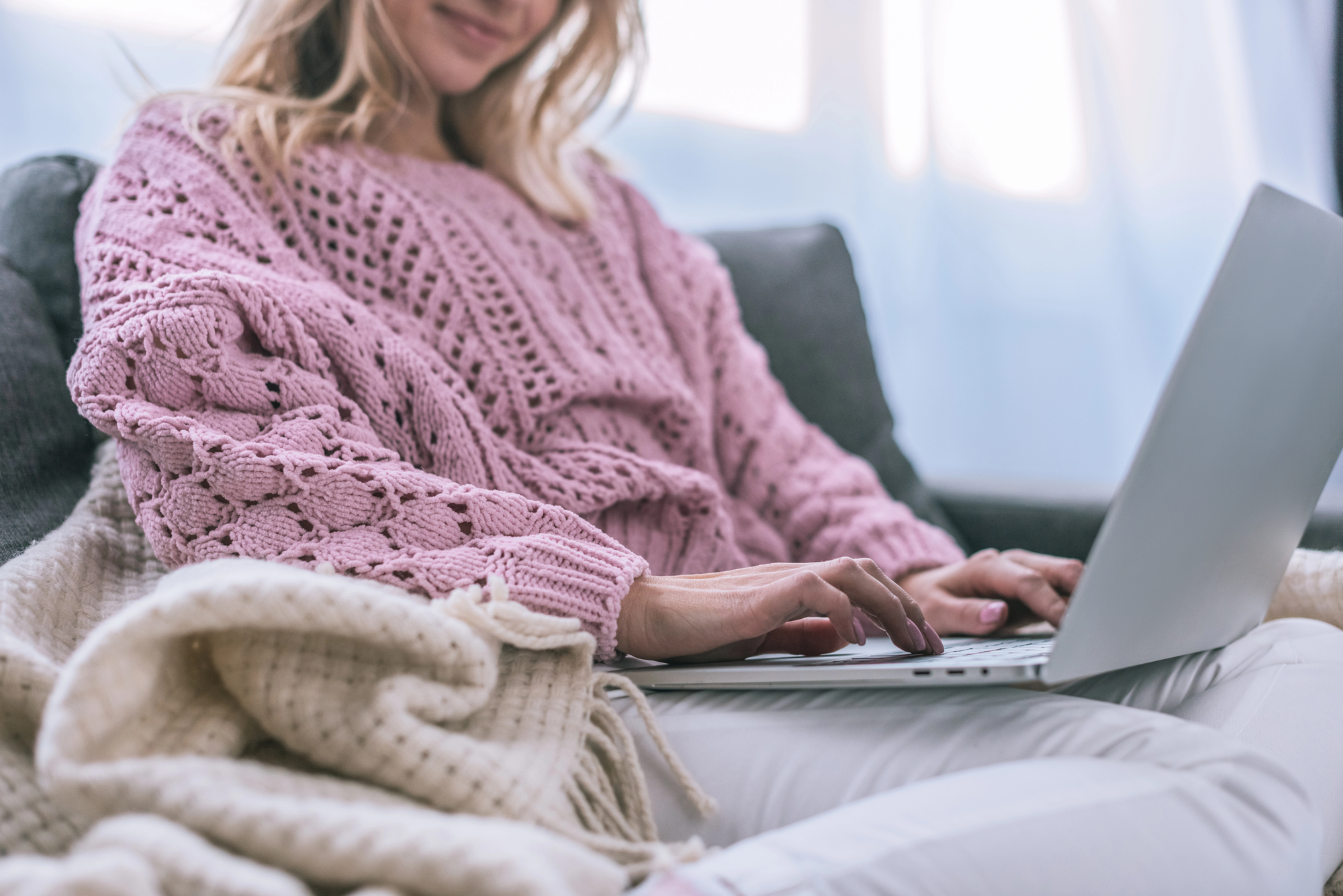How to Be a Successful Freelancer – a remote worker typing on a laptop